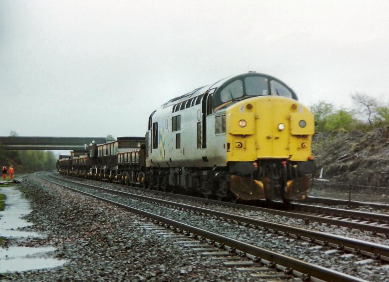 Photo of 37051 with the return Perth ballast at Plean.