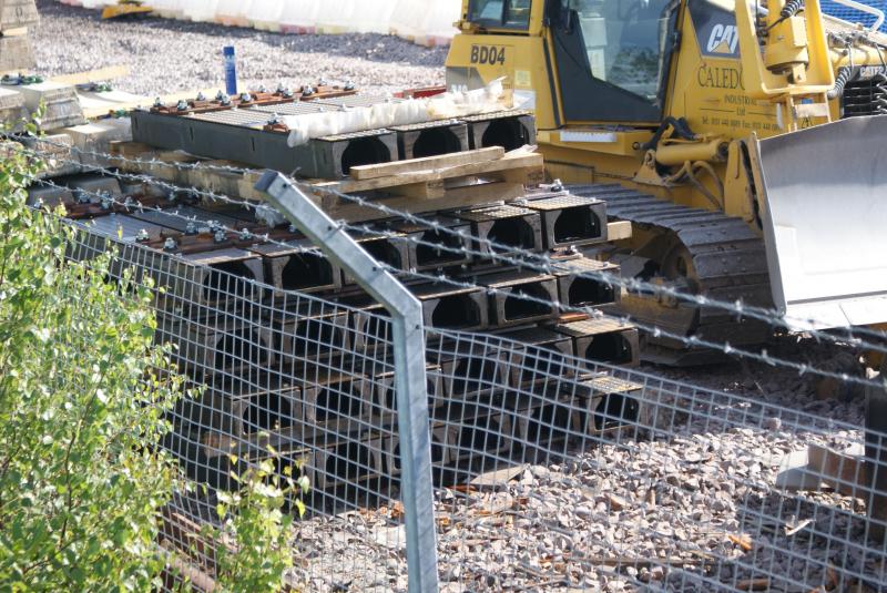 Photo of Stack of hollow sleepers at the former Stirling Engineer's Sidings. 21.07.13