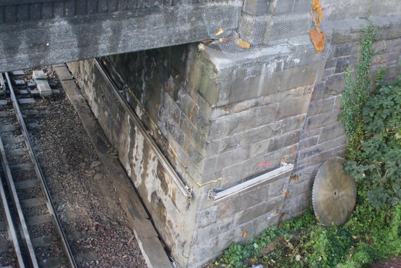 Photo of The Riverside abutment at Shore Road with guide rails in place for the wall saw.