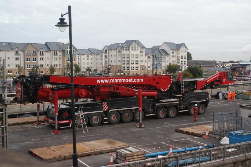 Photo of The crane base being positioned onto the perched jib at Stirling