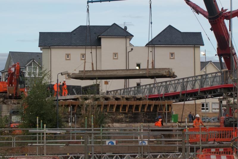 Photo of A close up of a deck section of Span 1 getting lifted out