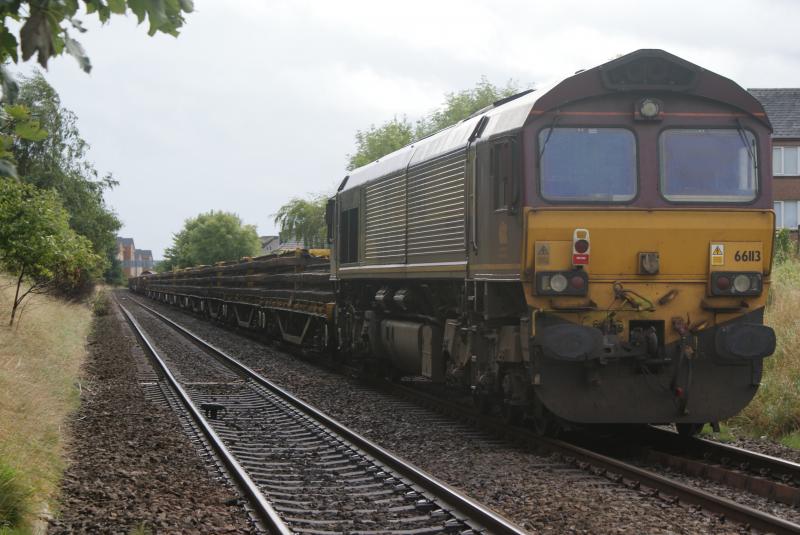 Photo of 66113 on 6K11 with its load off salmon and coalfish wagons