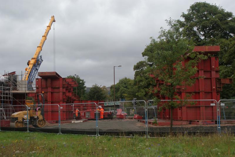 Photo of Transporters getting assembled and stilts for old bridge in place