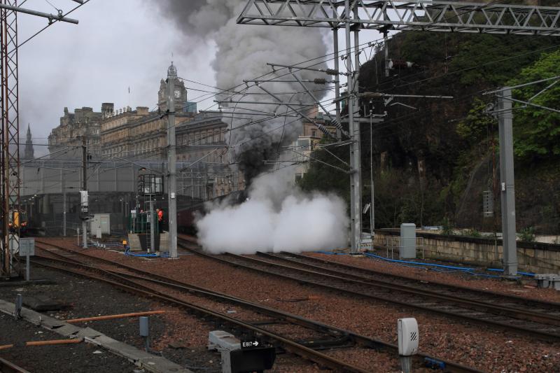 Photo of 60009 on 1Z28 in a cloud of steam