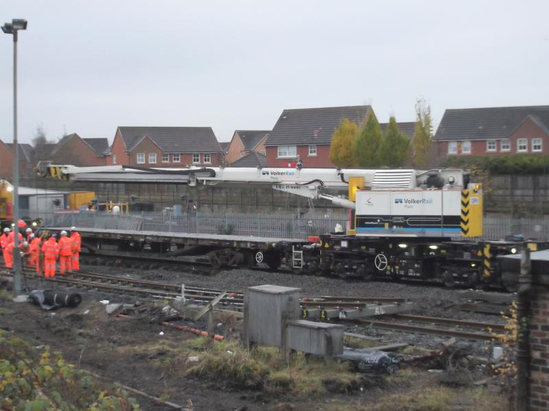 Photo of Kirow crane fitting points into sidings at Larbert