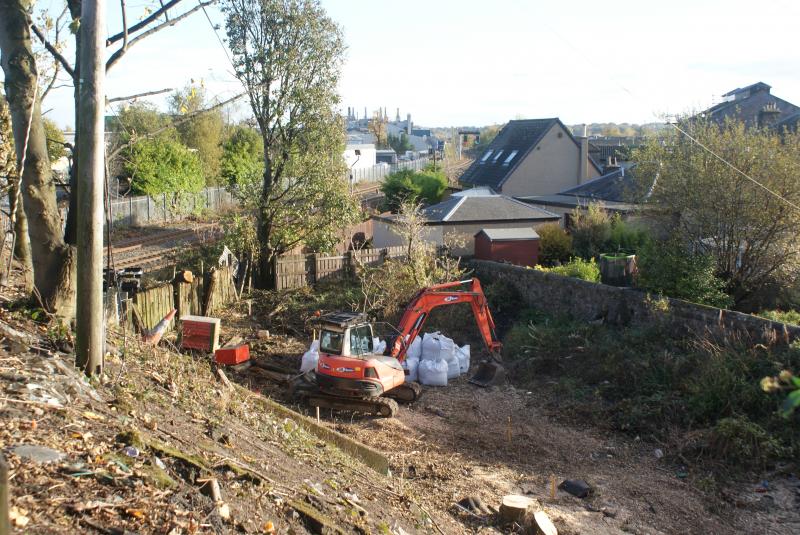 Photo of Kerse Road, Stirling city centre side footbridge abutment plinth marked out - looking towards the railway