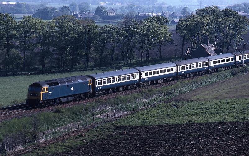 Photo of  Class 47 approaches Midcalder Junction in 1980